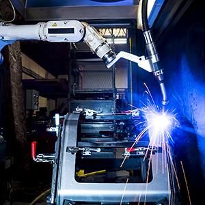 Credit: © Chris Fertnig/Getty Images
Caption: A CNC robotic welding machine in a metal manufacturing plant