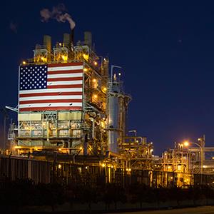 An American flag hangs at a BP oil refinery in Wilmington, Calif. (© Jim West/Alamy)