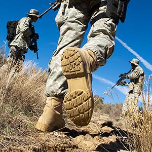 Caption: Soldiers walking in field
Credit: © West Coast Surfer/Getty Images