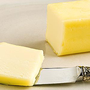 Credit: © Roel Smart/Getty Images
Caption: Butter and knife on a plate