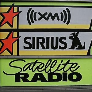 Caption: XM Satellite Radio & Sirius Satellite Radio products Credit: © Damian Dovarganes/AP