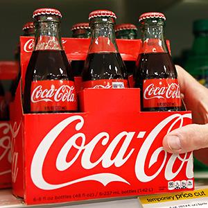 Caption: An employee arranges bottles of Coca-Cola at a store in Alexandria, Va.
Credit: © Kevin Lamarque/Reuters