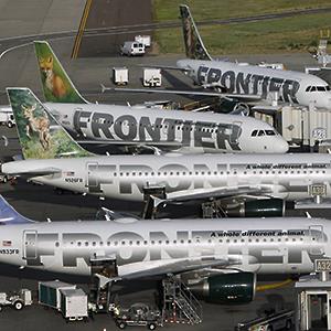 Frontier Airlines planes wait at their gates at the Denver airport © Rick Wilking/Reuters