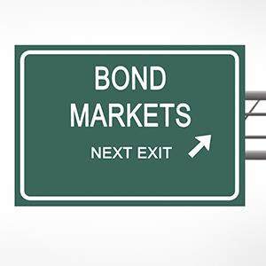 Credit: © vaeenma /Getty Images
Caption: Road sign to bond market
